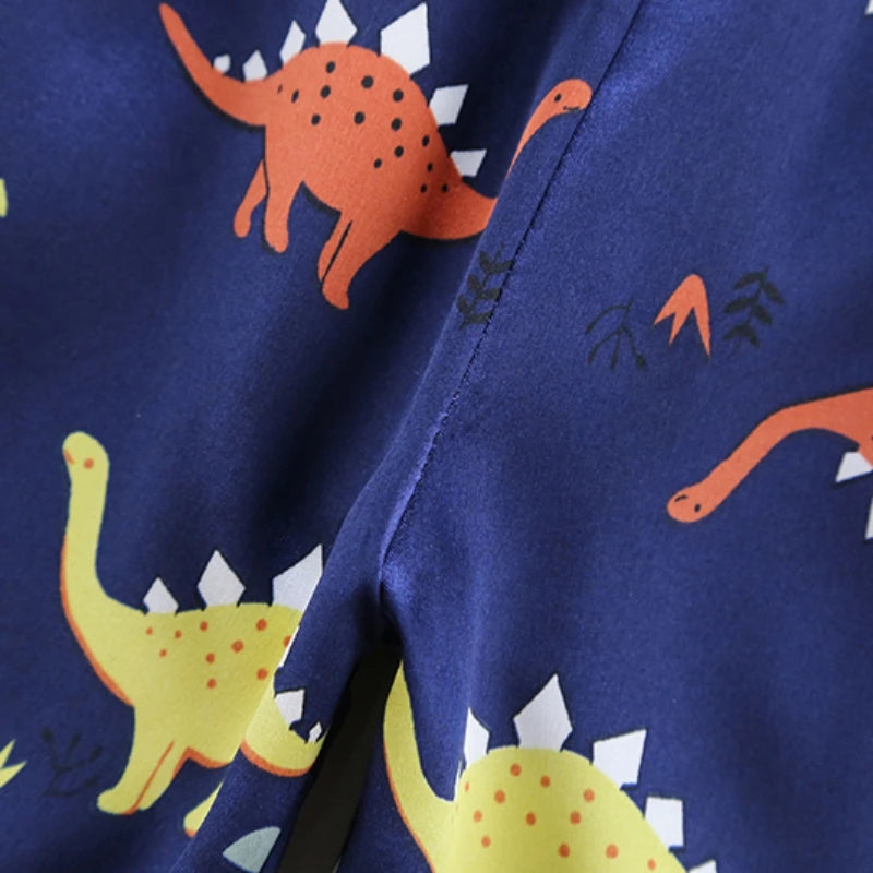 Cozy and Cute: Kids Dinosaur Print Pajama Set for Sweet Dreams!