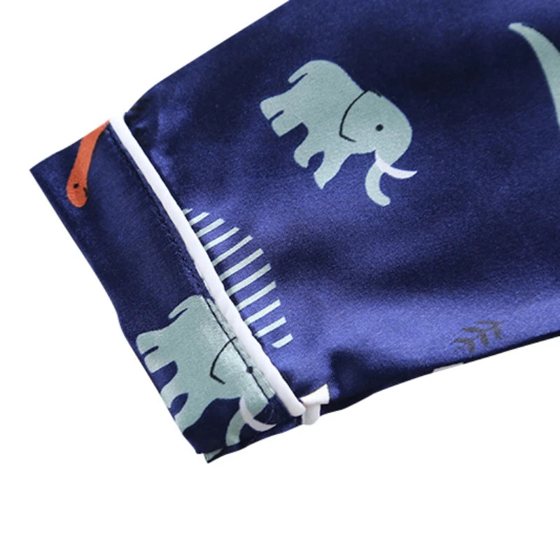 Cozy and Cute: Kids Dinosaur Print Pajama Set for Sweet Dreams!